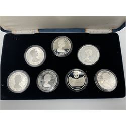 The Royal Mint silver proof seven coin set, comprising United Kingdom and six Commonwealth crowns, commemorating 'Her Majesty Queen Elizabeth The Queen Mother's 80th Birthday', cased with certificate
