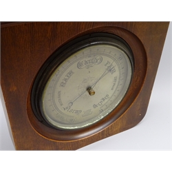  Edwardian Aneroid barometer, circular silvered dial marked F.J.Gould Optician 50 Cherry St.Birmingham, 23cm diam in oak frame with moulded cornice, H35cm, W42cm  