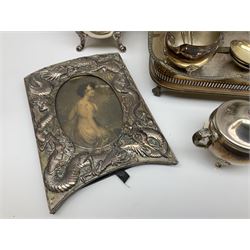 Chinese silver plated photograph frame, decorated in relief with dragons, H24.5cm L18cm, aperture H15cm L10.5cm, together with a group of silver plate, to include two handled tray with pierced gallery, upon four claw feet, Viners four piece tea set, small selection of flatware, etc. 