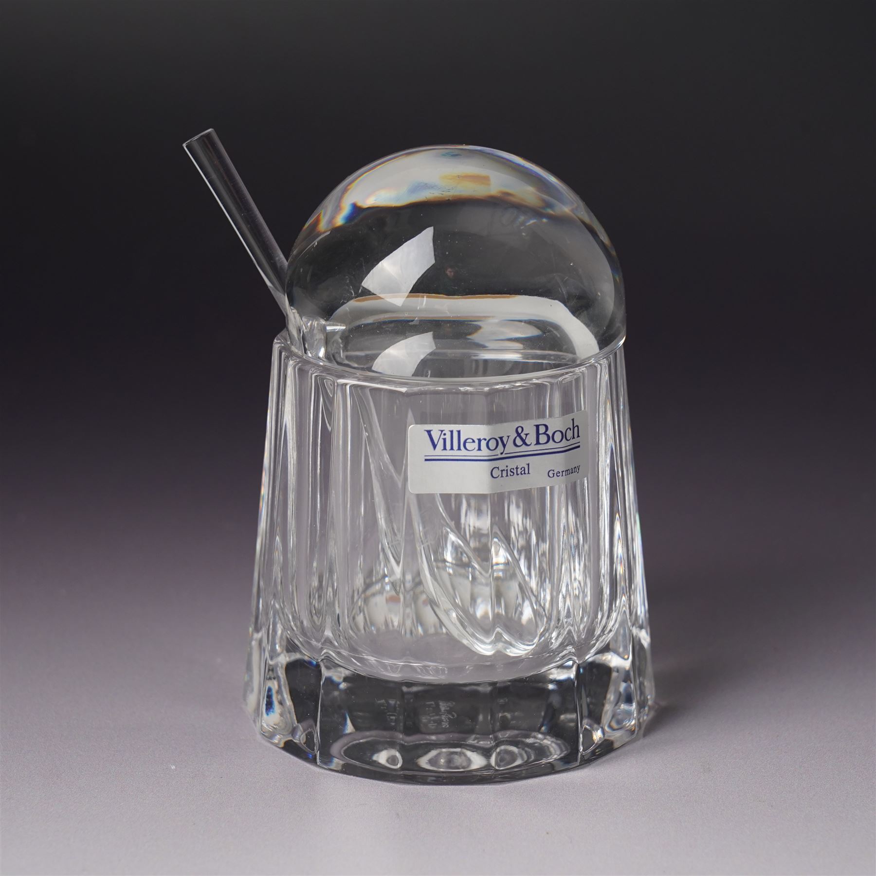 Three Dartington Crystal examples designed by Frank Thrower, comprising two oils and vinegar bottles, and one decanter, together with a covered jar with spoon designed by Palona Picasso for Villeroy & Boch, all boxed (3)