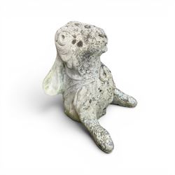 Two weathered cast stone garden hares