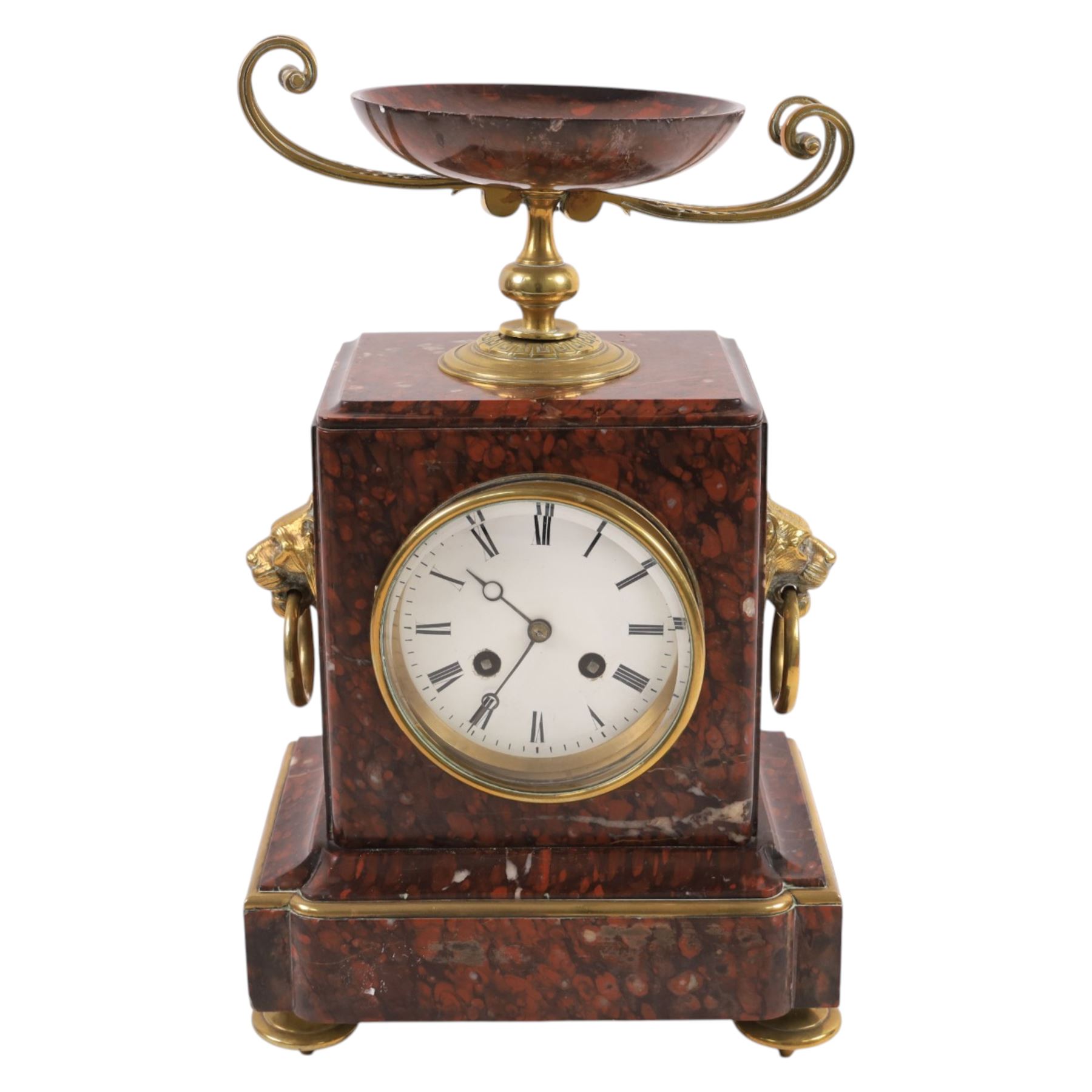 Neo-Classical red marble clock garniture, eight day movement, with urn top and lion mask handles, H34cm
