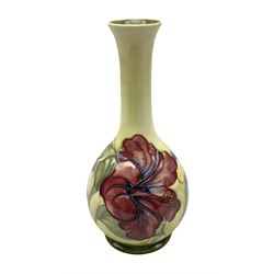 Moorcroft Hibiscus pattern vase of  fluted form on a yellow ground, with impressed mark beneath, H20cm