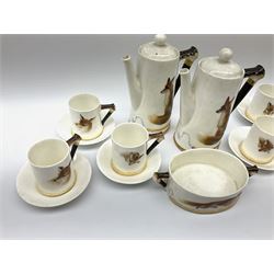 A Royal Doulton Reynard the Fox pattern coffee set, comprising two coffee pots, open sucrier, six coffee cans and six saucers, decorated in low relief with foxes, with printed marks beneath. 