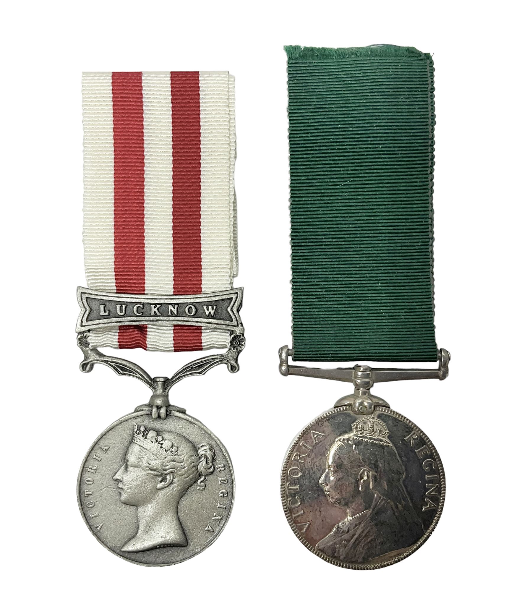 Victoria Long Service in the Volunteer Force Medal awarded to 369 Bombr. W. Woodward 1st Lincs. V.A.; and reproduction Victoria India Medal with Lucknow clasp; both with ribbons (2)