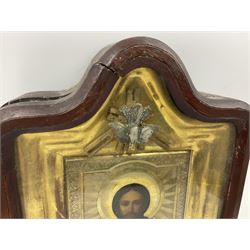 Early 20th century oil on panel religious icon of Jesus, with gilt detail, surrounded by a gilt frame within a hinged glass wall hanging, H25cm, L18cm  