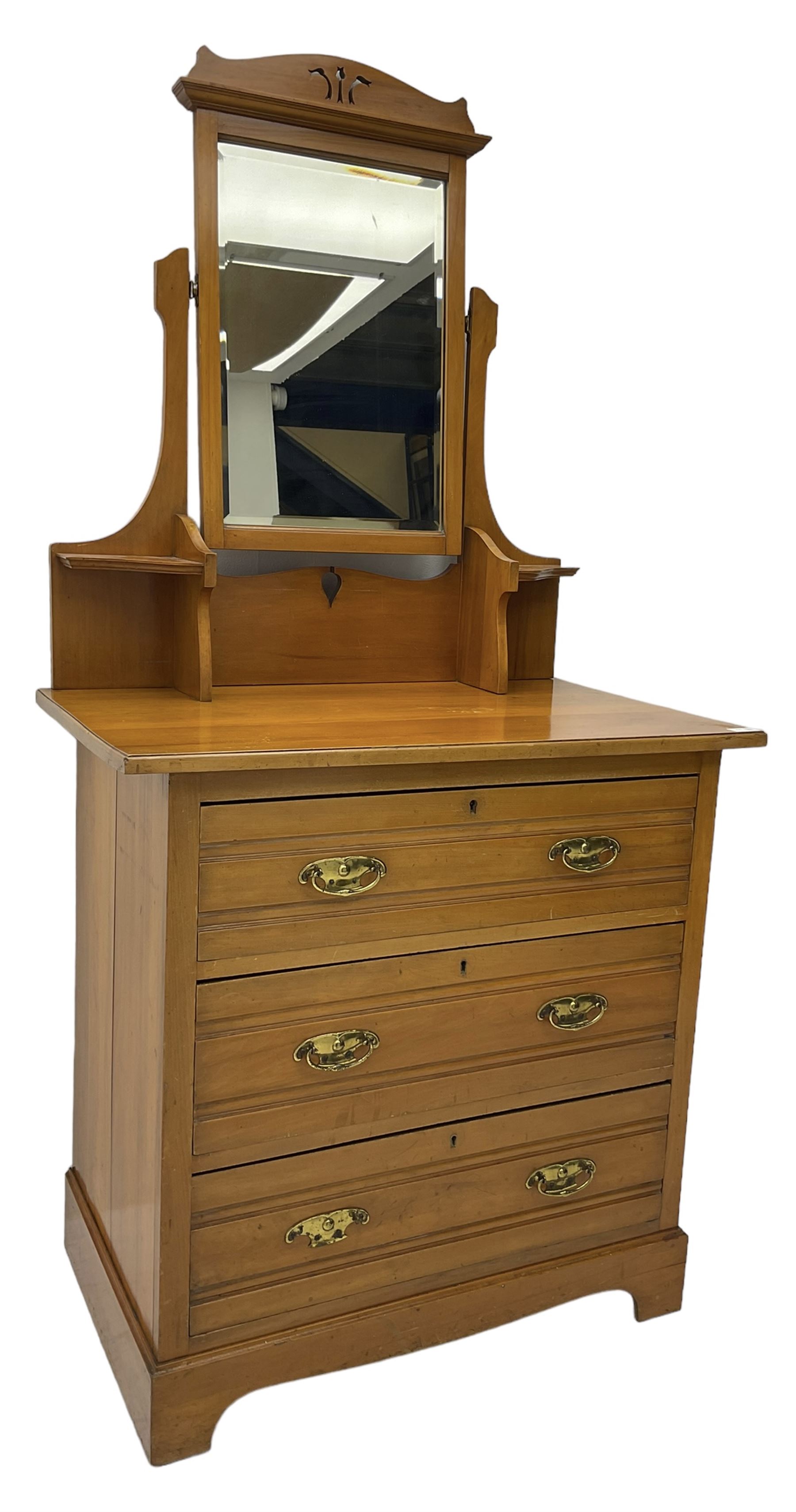 Edwardian satin walnut dressing chest, raised bevelled mirror back, the base fitted with three drawers