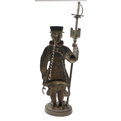 A cast iron figural companion set modelled as a Beefeater, H83cm. 