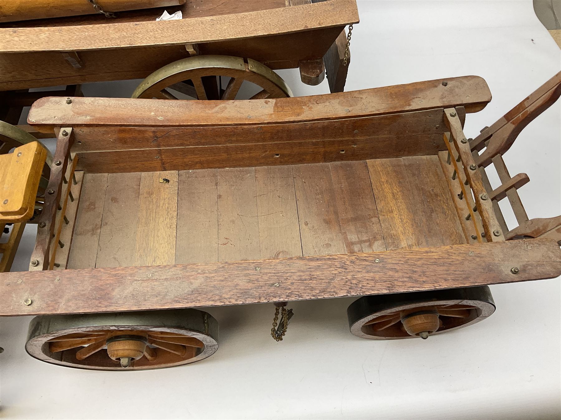 Four Melba Ware Shire horse figures and another similar, and three wood carts