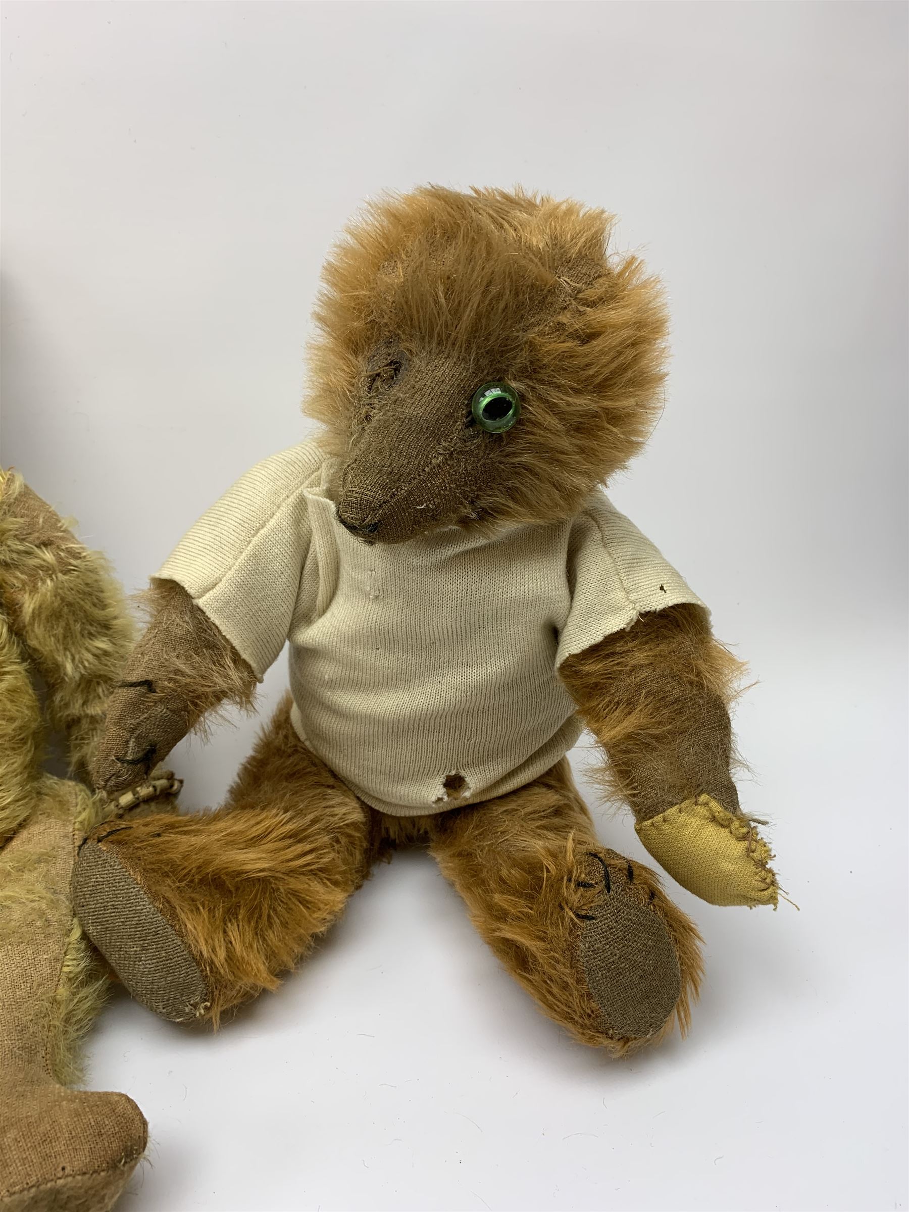 Early 20th century cinnamon coloured bear c1920, possibly continental, with unusual hedgehog styled head/face, swivel jointed head, wood wool filled body with jointed limbs, five claw stitches to feet  and inoperative growler mechanism H16