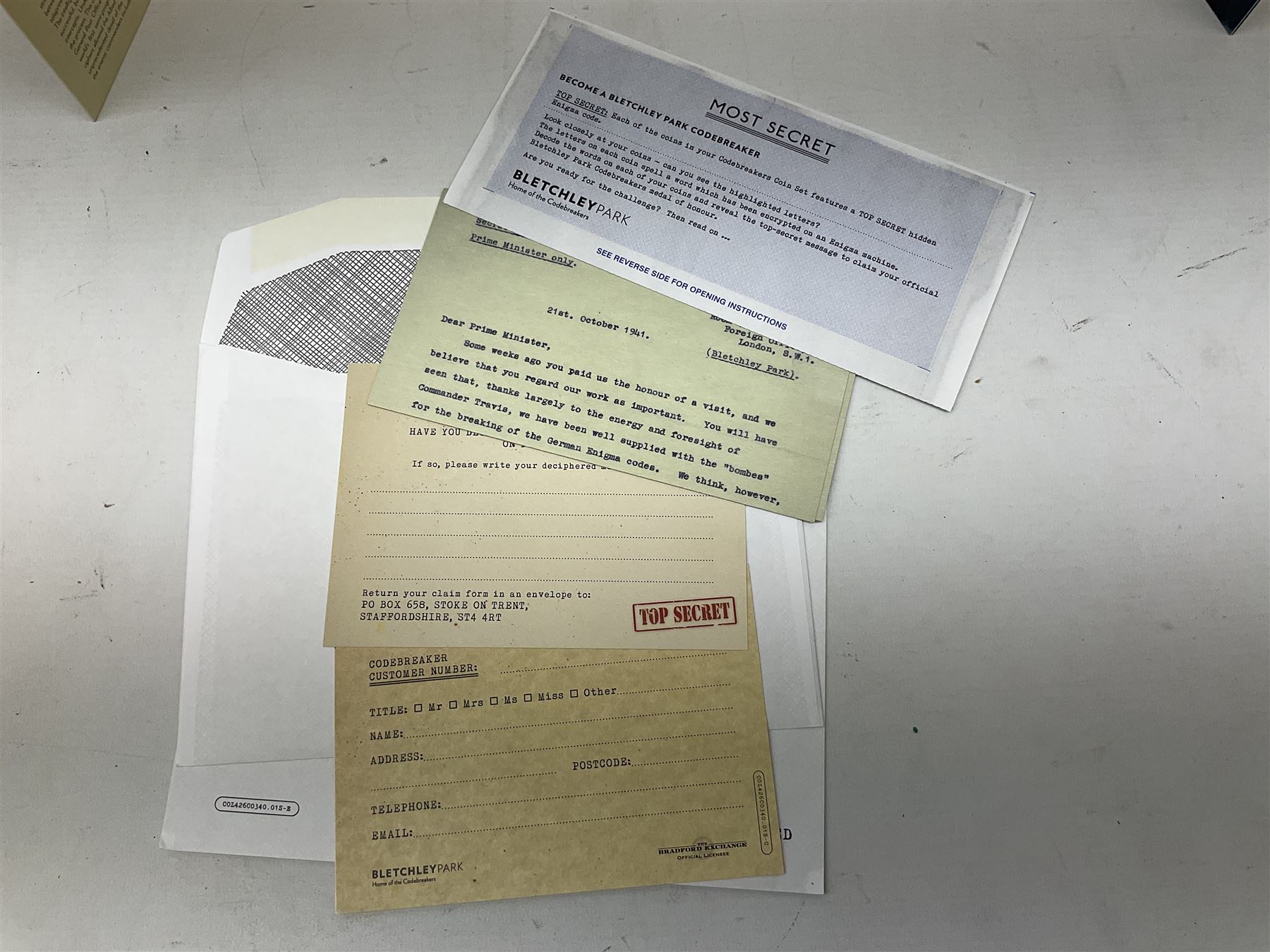 Queen Elizabeth II Tristan Da Cunha 2021 Bletchley Park seven coin set, including 'Bombe Machine' 9ct gold coin weighing 2.75 grams, housed in a presentation folders with certificates