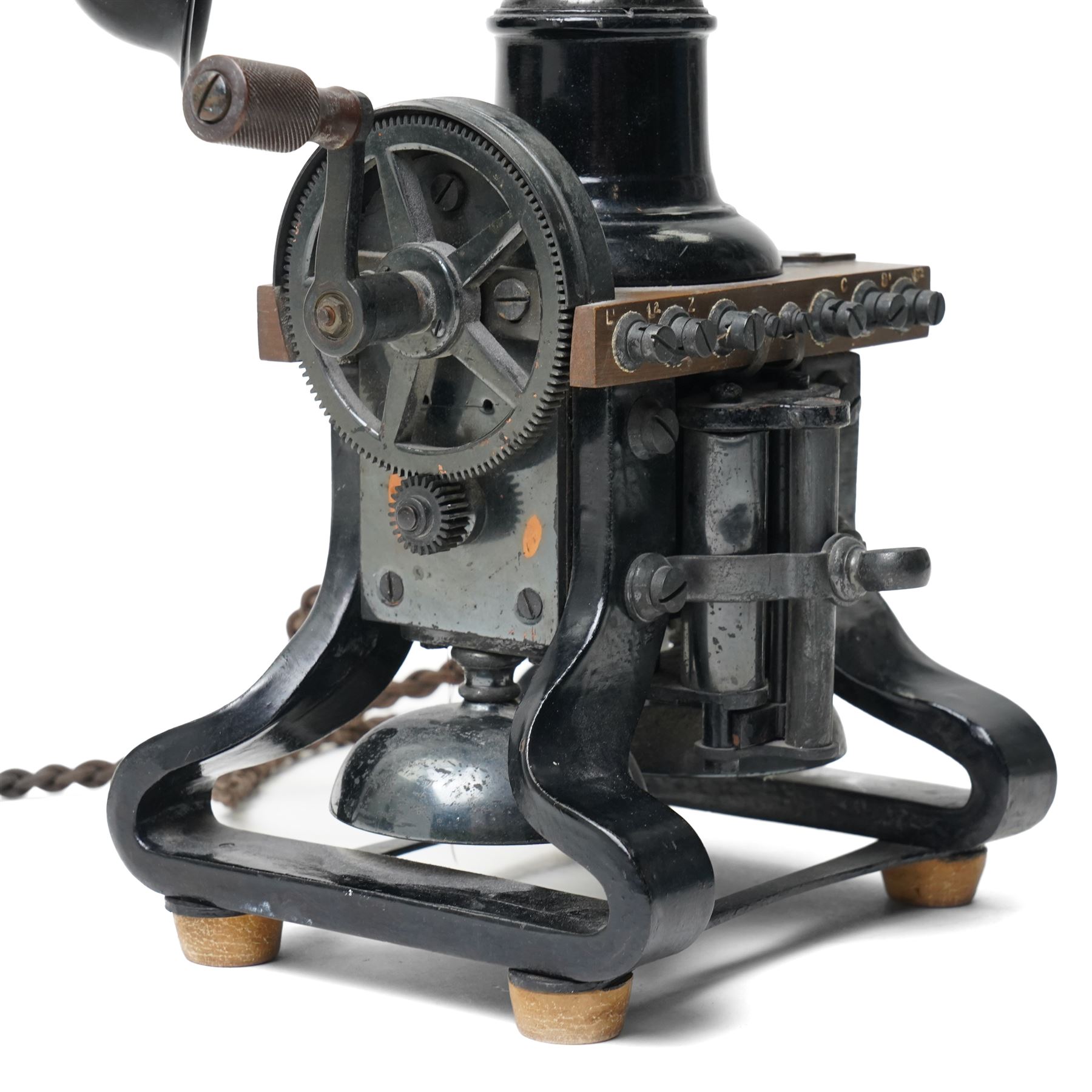 Early 20th century L M Ericsson & Co Skeletal table telephone, the earpiece impressed No.28, with black painted frame and possibly original wires, H29cm