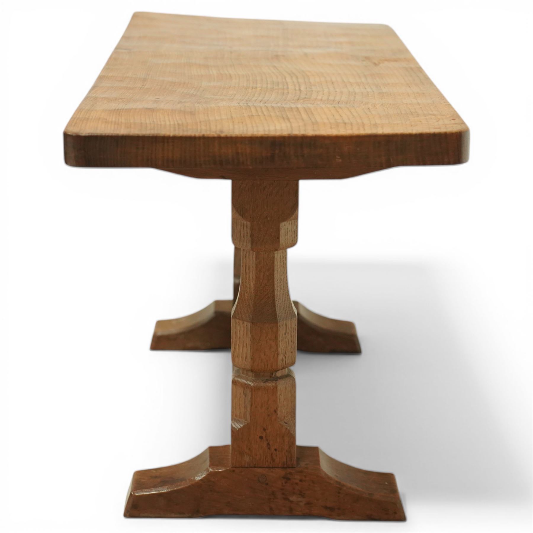 Mouseman - oak rectangular adzed coffee table, octagonal supports united by stretcher terminating in sled feet, with carved mouse signature, by the workshop of Robert Thompson of Kilburn 