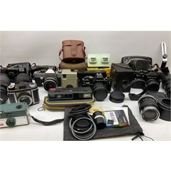 Vintage and later cameras, lenses, accessories and darkroom equipment including Zenit 12XP camera, Praktica BX20 camera fitted with 'Sigma Zoom Master 1:3.5-4.5 f=35-70mm' lens, Praktica LLC camera fitted with 'Carl Zeiss Jena Pancolar 1.8/50' lens, Canon Zoom Lens 'EF 100-300mm 1:5.6', various Jessop and other makers darkroom items including safelight (Red), universal duo tank, multi-mask enlarging easel etc, in three boxes