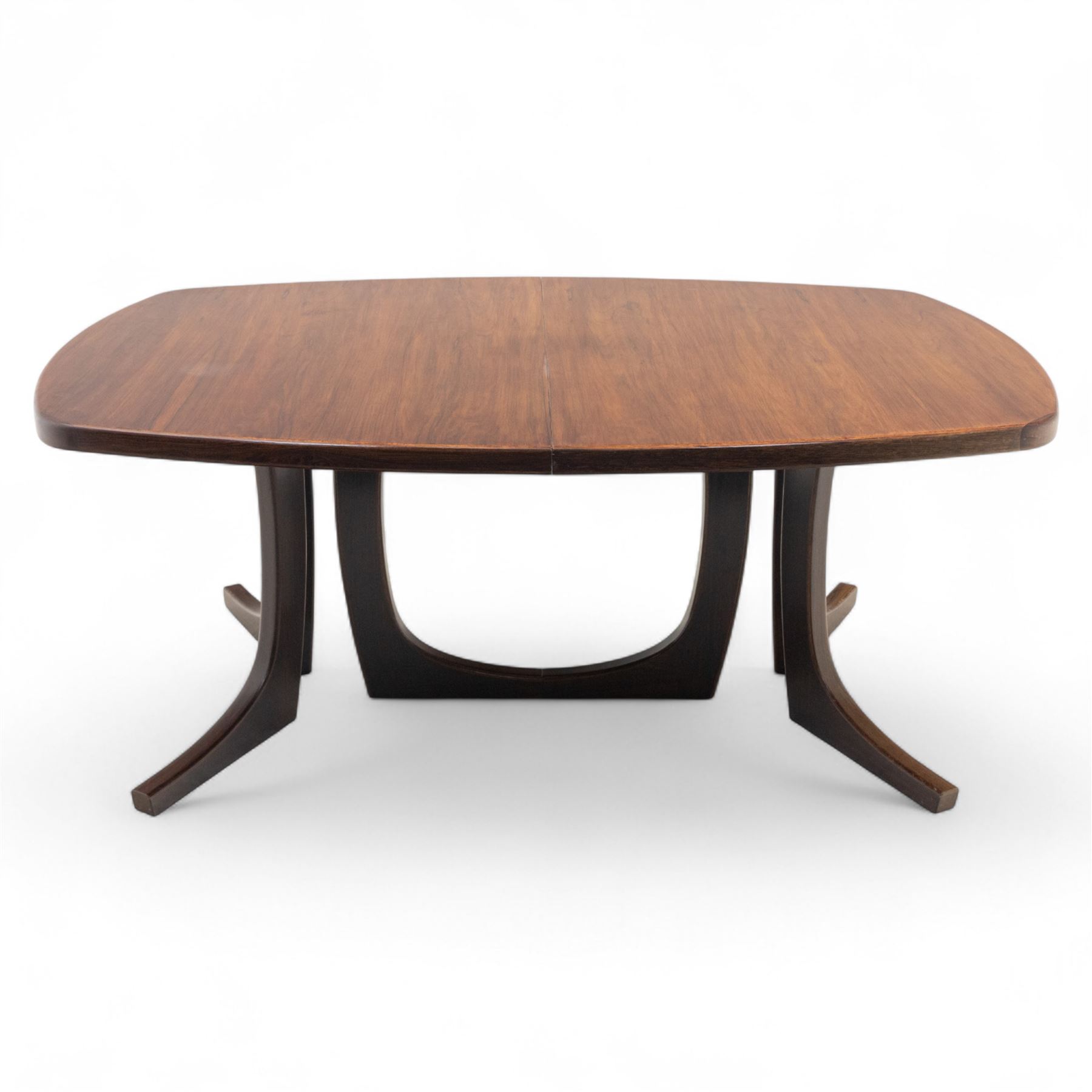 Lynggard Møbler - mid 20th century Danish teak extending dining table, the rounded rectangular veneered top with concealed central leaf, raised on twin sculpted pedestal bases, (Extends to 300cm) combining fine craftsmanship and organic form typical of Scandinavian modern design from the 1960s