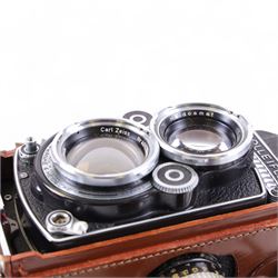 Rolleiflex Franke & Heidecke DBP DBGM 2.8 F TLR camera serial no. 2439093, with a Heidosmat 1:2.8/80 lens serial no. 894062 and a Carl Zeiss Planer 1:2.8 f=80mm lens serial no. 4092068, in leather case with instruction booklet