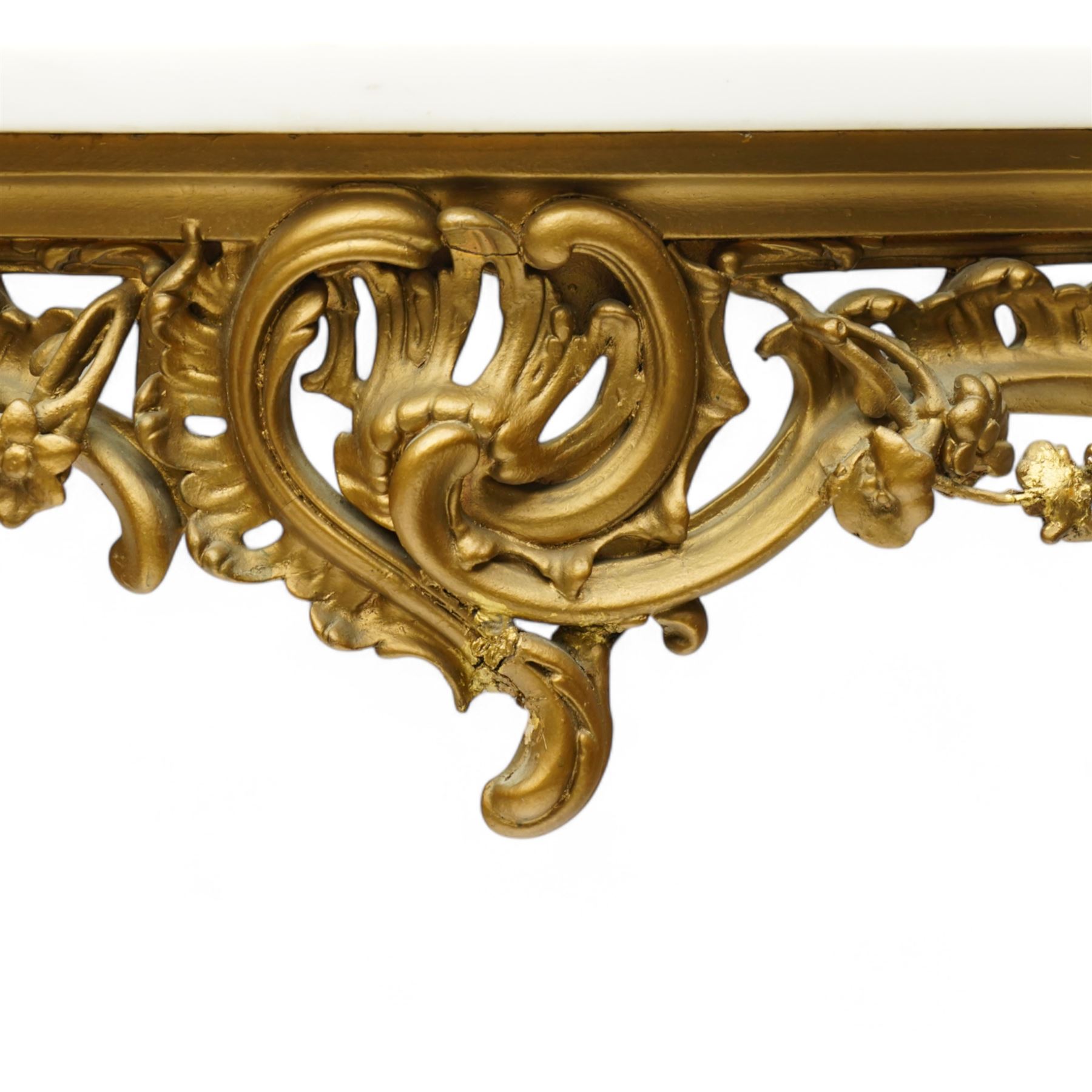 Late 19th to early 20th century giltwood and gesso console table with marble top, shaped white marble top, the base with pierced front decorated with shells and trailing leafy branches with flower heads, on cabriole supports with shell decorated knees, scrolled feet with acanthus leaf terminals 