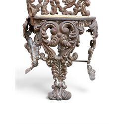 19th century Rococo Revival cast iron garden chair, pierced back comprised of scrolling acanthus leaves, over a pierced geometric white painted drop-in seat, raised on four acanthus and anthemion shaped cabriole supports united by X-frame stretcher