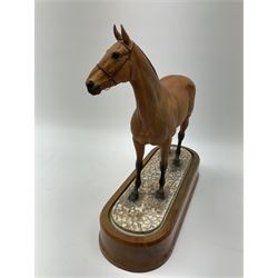 A Royal Worcester limited edition figure, Arkle, owned by the Duchess of Westminster, modelled by Doris Lindner, on wooden base, H27cm. 
