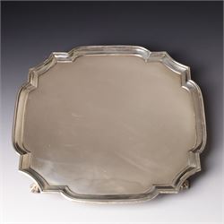 Square silver salver with canted corners and raised border on claw and ball feet 25cm London 1934 Maker Searle & Co Ltd
