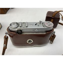 Kodak Retina III camera with 'Schneider-Kreuznach 3977724 Retina-Xenon C f:2/50mm' lens in leather case, and Brownie Model D in leather case