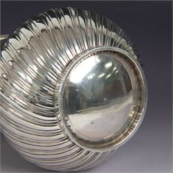 Victorian silver coffee pot, of part fluted baluster form, with central oval cartouche engraved with peryton crest, bordered by C scrolls and chased scales, with impressed acorns, stars and leaves throughout, with wooden handle and finial to domed hinged cover, hallmarked Charles Stuart Harris, London 1883, H23cm