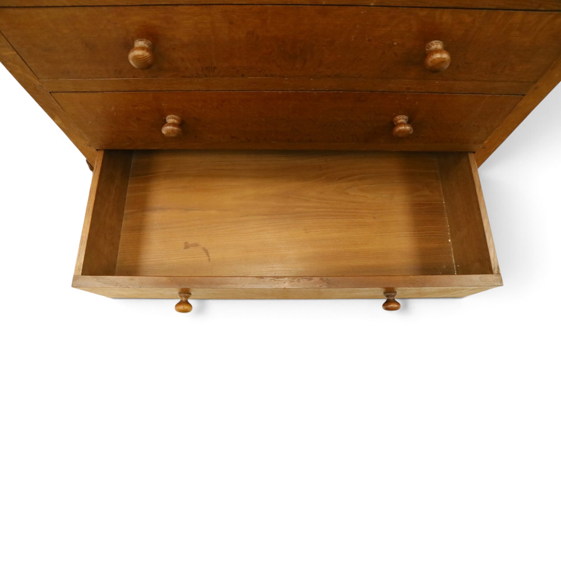 Mouseman - early-to-mid 20th century adzed and panelled oak chest, raised back over rectangular adzed top with canted corners, fitted with two short over three long drawers with turned knob handles, raised on octagonal feet, with carved mouse signature, by the workshop of Robert Thompson of Kilburn