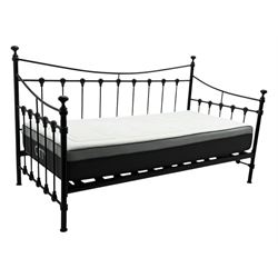 Contemporary Victorian revival black metal day bed, featuring arched back and sides with turned finials and spindle rails, complete with single 'OTTO' mattress
