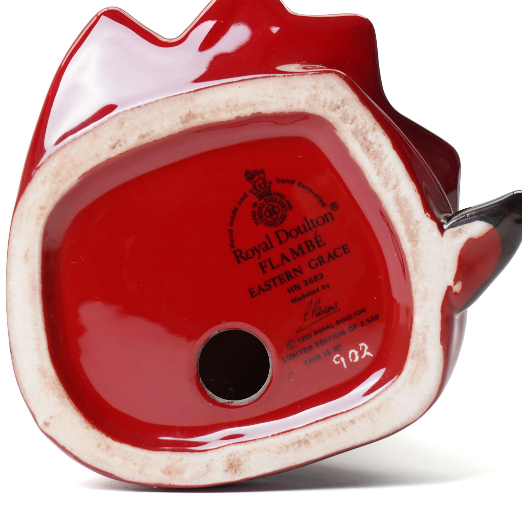 Three Royal Doulton flambe figures  'Wizard' HN3121,  'Eastern Grace' HN3683 limited edition 902/2500 and 'Genie' HN2999 (3)