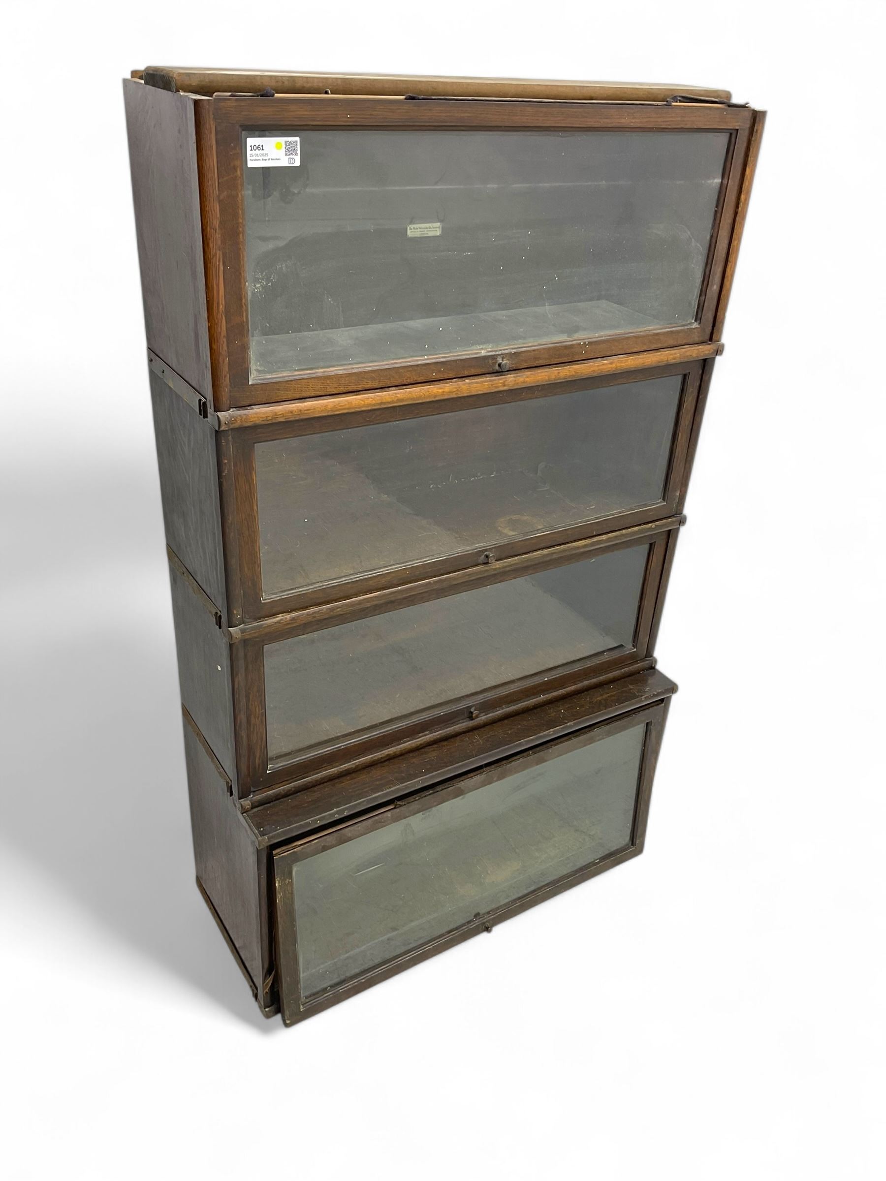 Globe Wernicke - early 20th century oak four-tier stacking library bookcase, four glazed sections enclosed by hinged and sliding doors