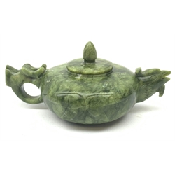 A carved jade teapot, the spout modelled