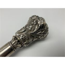 Silver topped walking cane, with embossed decoration in the Victorian taste of flowers, berries and acanthus leaves, stamped 925, upon an ebonised shaft, L94cm