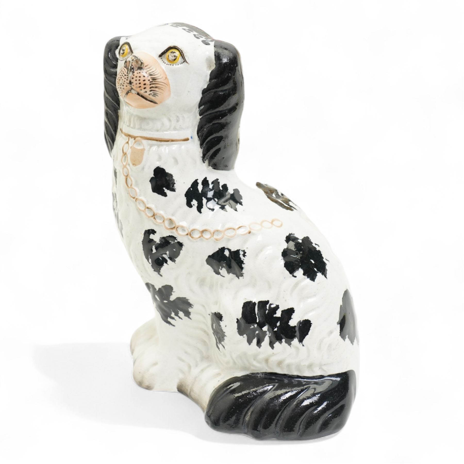 Staffordshire pottery figures including watch stand with piper and companion, pair of dogs and pups, pair of fish sellers and two others