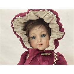 Armand Marseille bisque head doll with applied hair, sleeping eyes, open mouth with upper teeth and composition body with jointed limbs; marked ' Armand Marseille 390n, A2M, H46cm, with wooden stand