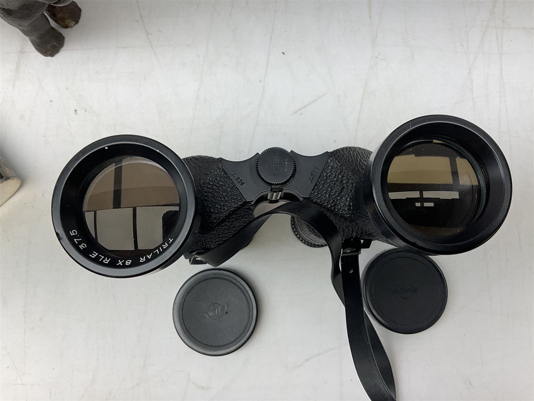 Cast metal nutcracker, in the form of a dog together with a pair of Swift Saratoga 8x40 binoculars in leather case and a hip flask, the glass flask covered in leather to the top with a detachable silver plated cup to base