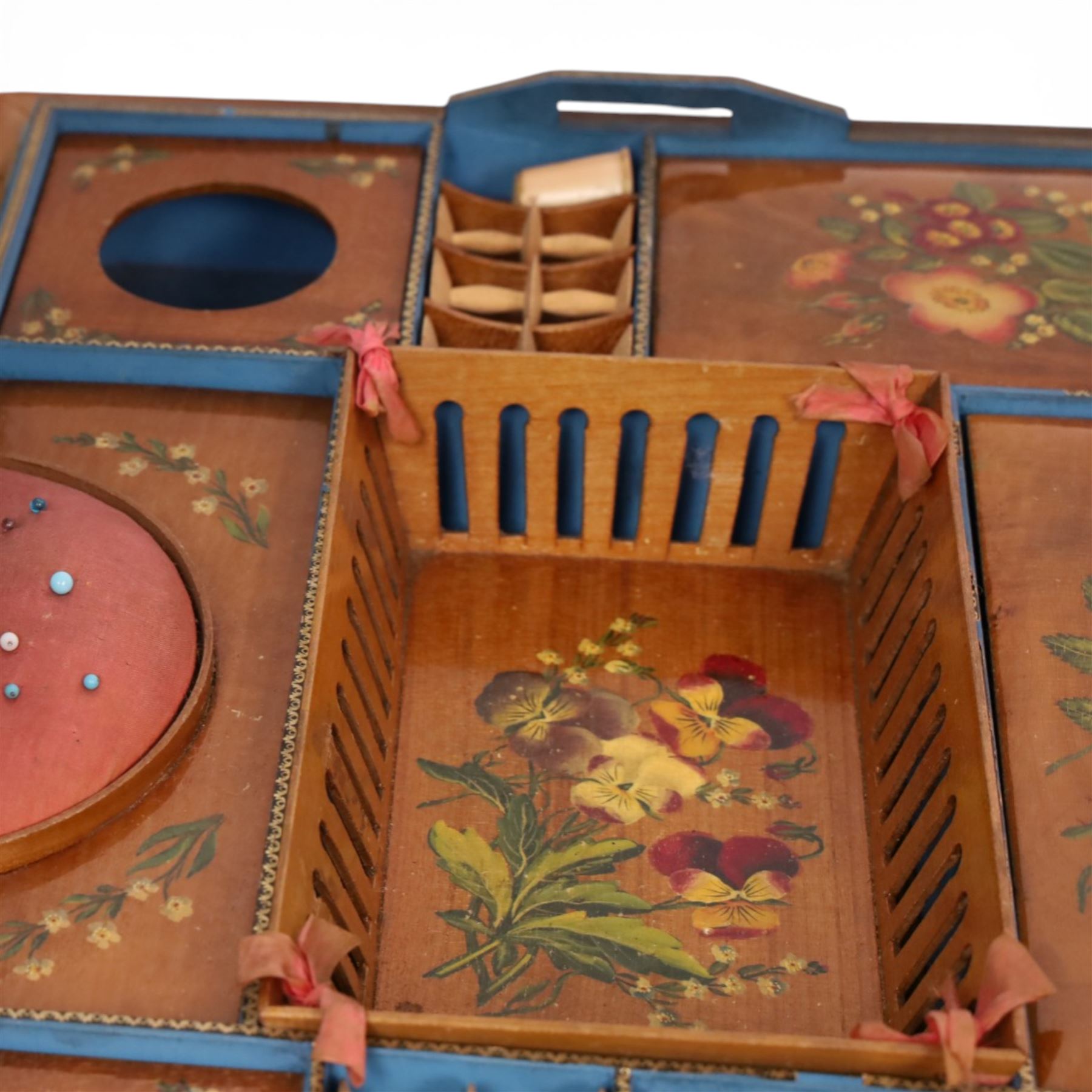 19th century satinwood sewing box, of rectangular form, the hinged cover with foliate decoration opening to reveal a removable compartmented tray with pin cushion, bobbins and removable central basket, painted with violas, upon compressed bun feet, H13cm L39cm D29cm