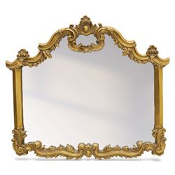 Late 20th century giltwood and composition over mantel mirror, with shaped and scrolled cr...