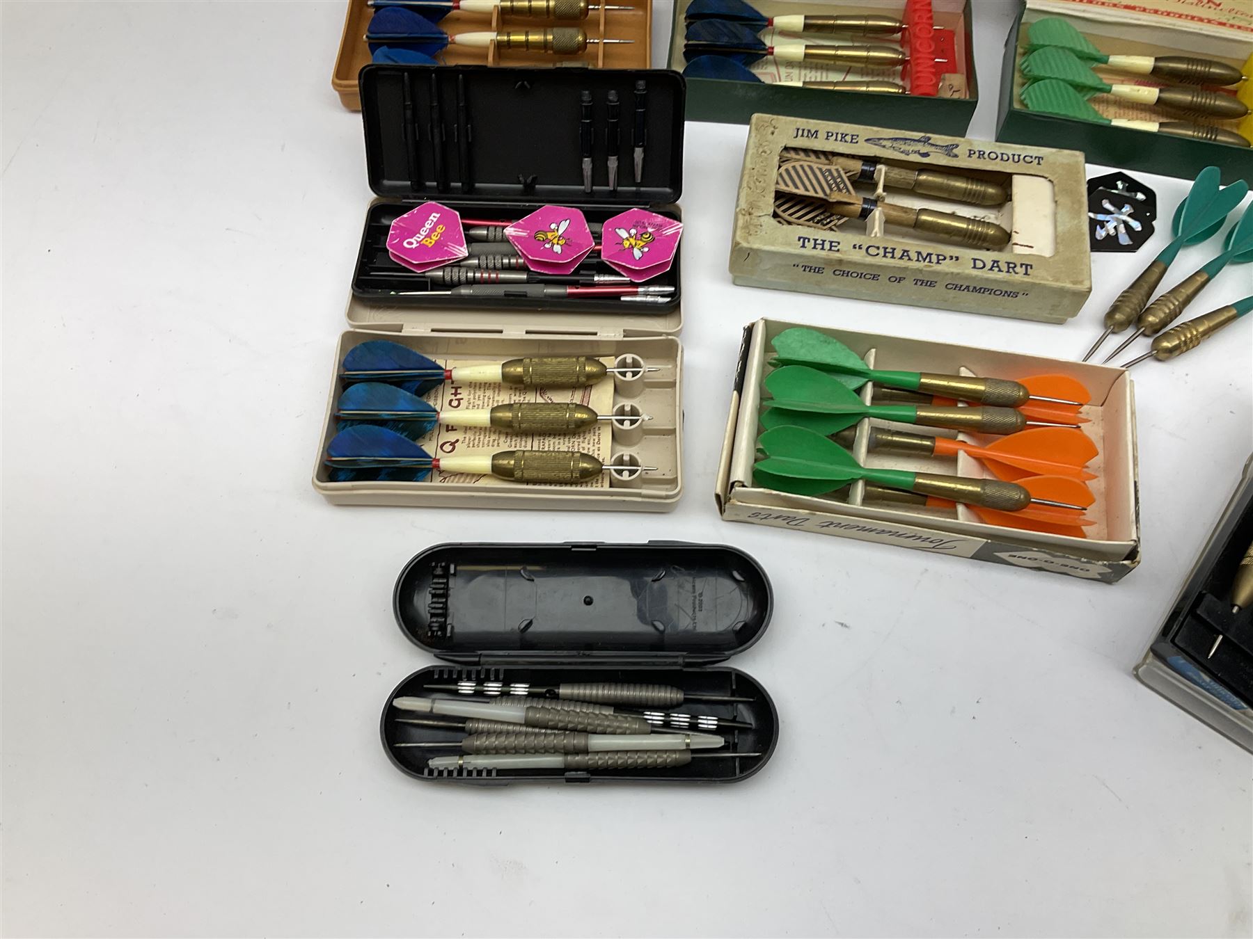 Nineteen sets of dartboard darts by Unicorn, Jim Pike, 'One-o-One', Farebrother etc, with various flights, shafts, styles and weights; predominantly boxed