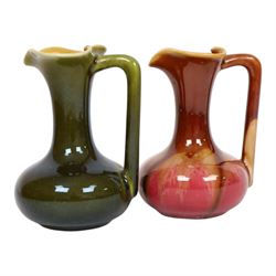 Christopher Dresser for Linthorpe Pottery, two of miniature jugs in red and green, shape n...