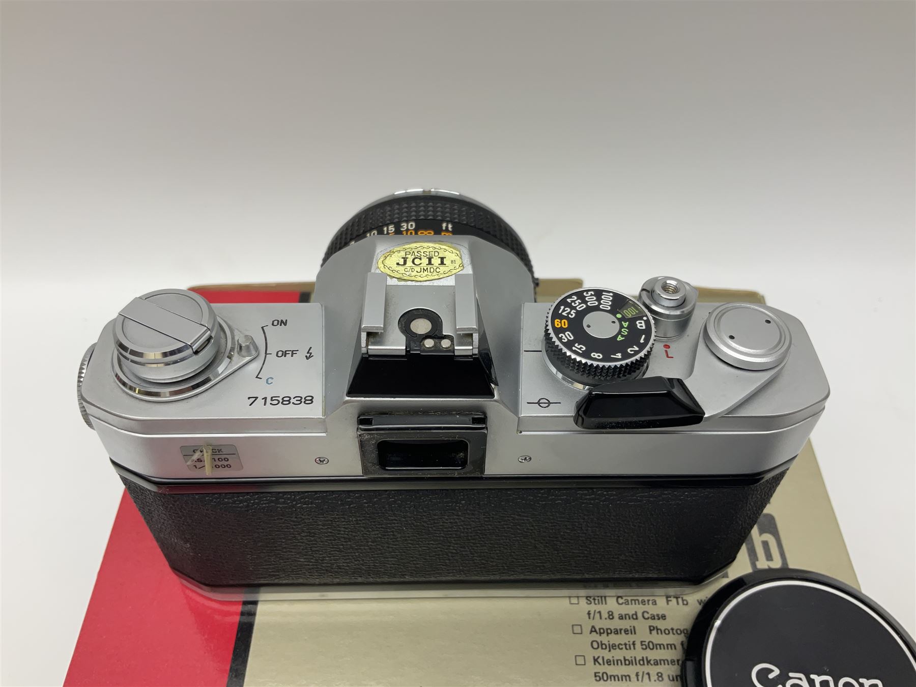 Canon FTb camera body, serial no. 715838, with 'Canon FD 50mm 1:1.8' lens, serial no. 207888, in original box, together with Canon FTb camera body, serial no. 557817, with 'Canon FD 35mm 1:3.5 S.C' lens, serial no. 126210 and Canon EX Auto camera body, serial no. 296244 with 'Canon EX 50mm 1:1.8' lens, serial no. 380869  