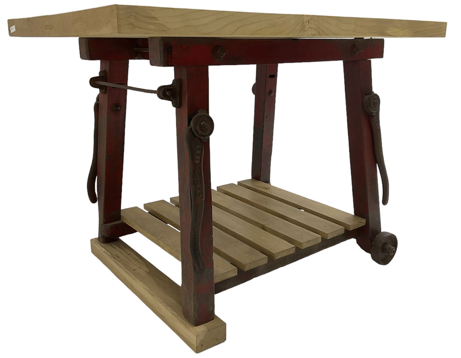 Kitchen island with rectangular maple top, on reclaimed machinery base with oak pot board, on block sledge feet