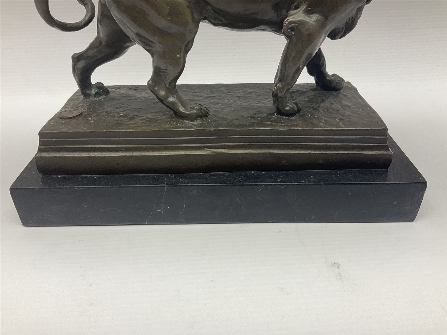 After Charles Valton, bronze, modelled as a lion, upon bronze plinth signed C H Valton, with foundry seal for J B Deposee, and black marble plinth base, overall H20cm L26cm