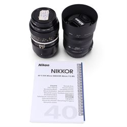 Two Micro-Nikkor camera lenses, comprising AF-S DX 40mm 1:2.8G with user manual, serial no. 2055767 and a 55mm 1:3.5 serial no. 1051782