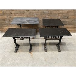 Four cast iron pub or bar tables with rectangular tops