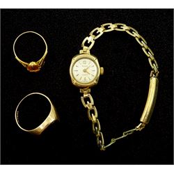 9ct gold onyx signet ring hallmarked, 9ct gold yellow paste stone set ring, tested and a 9ct gold Slava wristwatch, on gold-plated strap