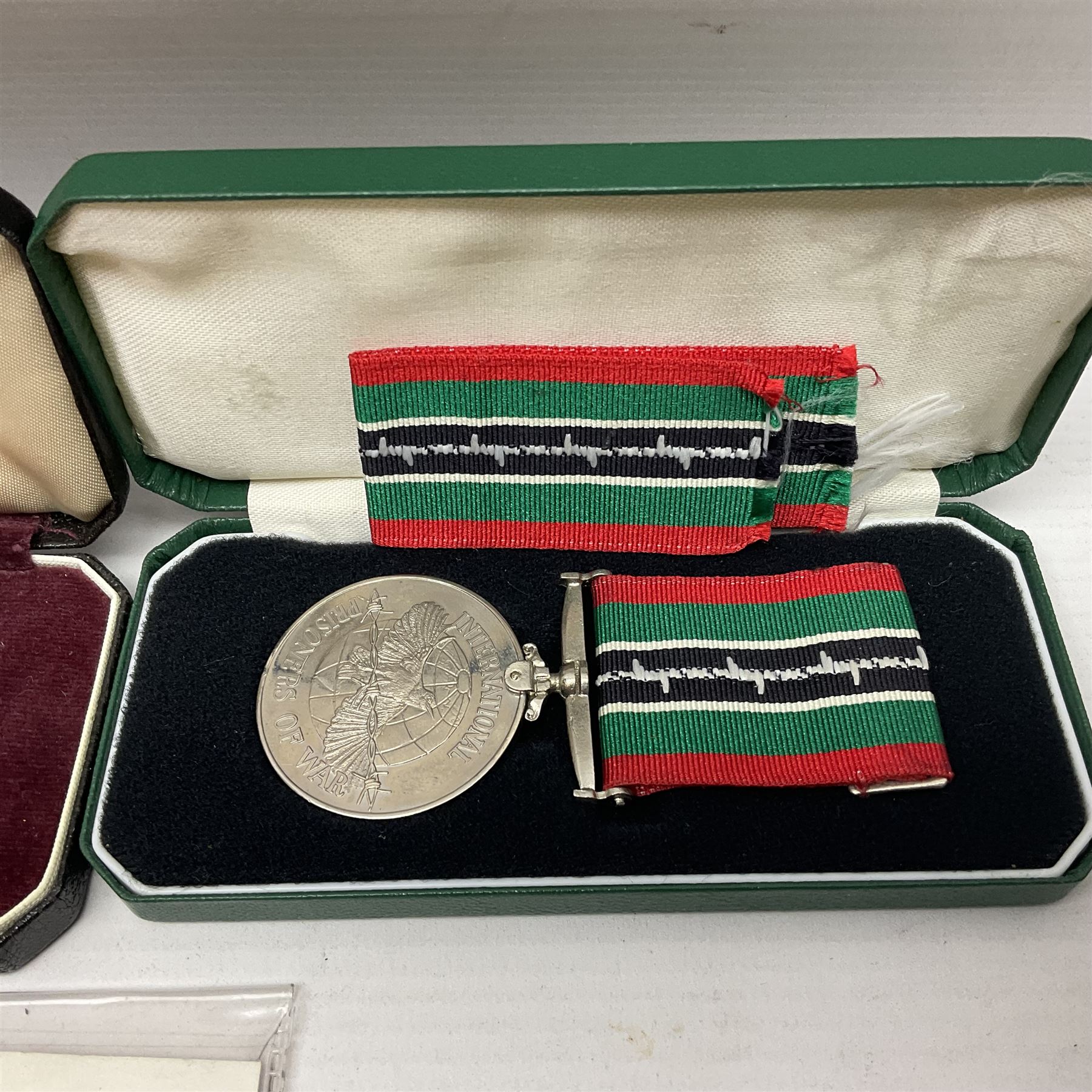 Two Imperial Service Medals to Elsie Hannah Ferguson and Fred Whitehead; each in original case; WWI Special Constabulary Medal to Inspr. Alfred W. Thompson; modern Prisoner of War Medal; cased; replica Victoria Cross and India Mutiny Medals with archive of information relating to Pte. Robert Newell V.C. 9th Lancers; replica Victoria Cross and George Cross with miniatures; and other replica medals etc