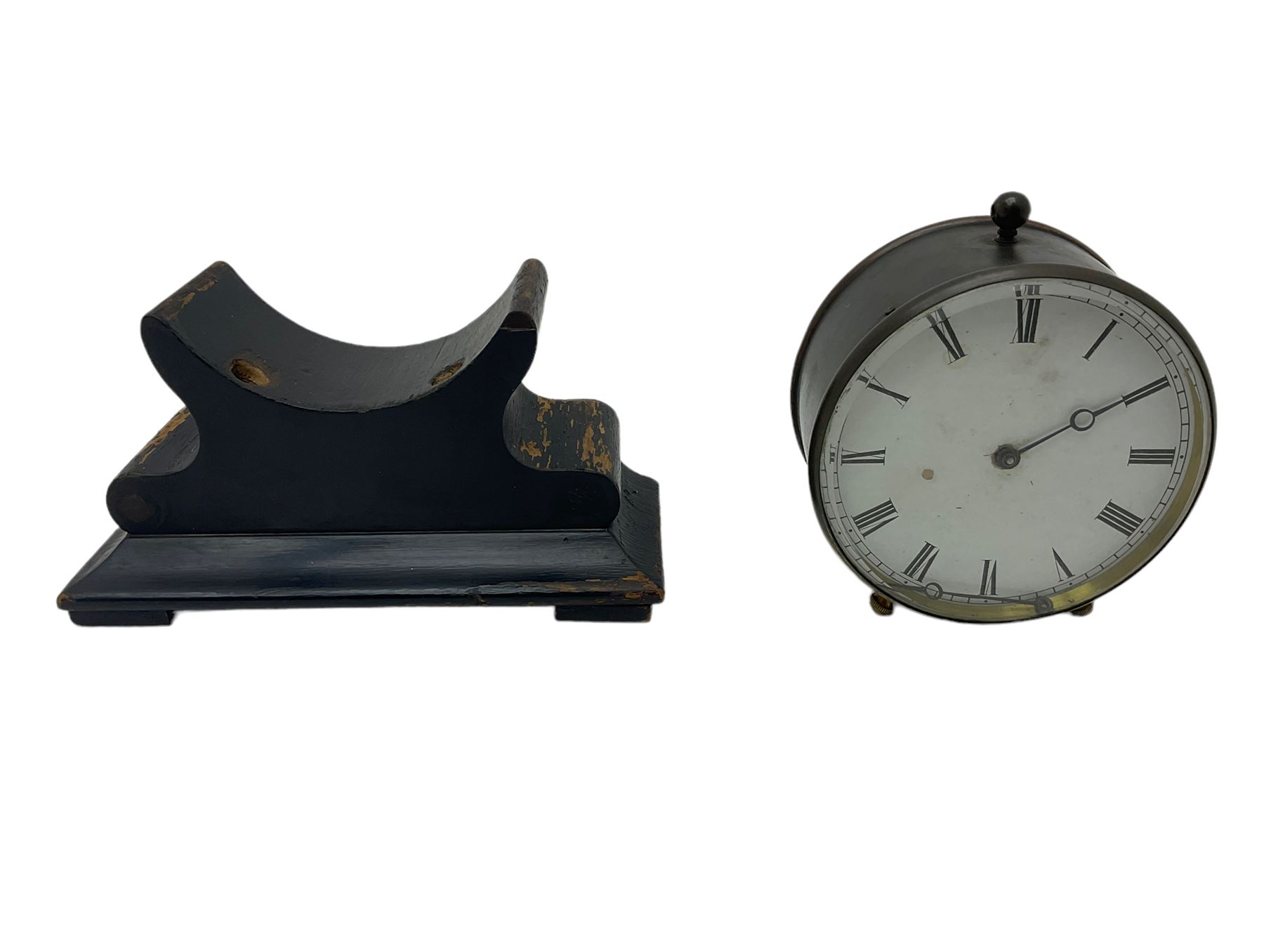 Late 19th century French Drum clock with an 8-day “tick-tack” movement, circular brass case and ebonised wooden stand, white card dial with roman numerals and steel moon hands, Parisian movement stamped VAP (Victor Athanase Pierret) with a deadbeat escapement, integral pendulum and key, wound and set from the rear.