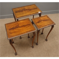  Reproduction nest of three edge banded mahogany tables, acanthus carved cabriole supports, claw feet W53cm, H61cm, D38cm  