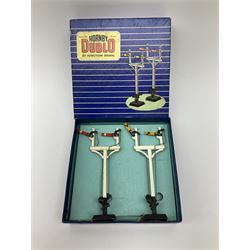 Hornby Dublo - twelve manually operated semaphore signals comprising one 5050 Signals Single Arm (D1) 2 Home, one 5060 Junction Signals (D3) 2 Home; D3 Junction Signal Upper Quadrant (1 Home 1 Distant); two 5055 Signals Double Arm (D2) 1 Home 1 Distant; two D2 Signals Double Arm (Upper Quadrant); three D2 Signals Double Arm Upper Quadrant Home - Distant; and two D1 Signals Single Arm Upper Quadrant; all boxed (12)