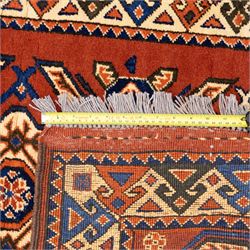 Two rugs, small Bokhara-type rug, terracotta ground with repeating hooked lozenge medallions enclosed by geometric borders (H 120cm, W 83cm); and a cream-ground rug, central lozenge medallion with geometric spandrels and border motifs (H 145cm, W 101cm),